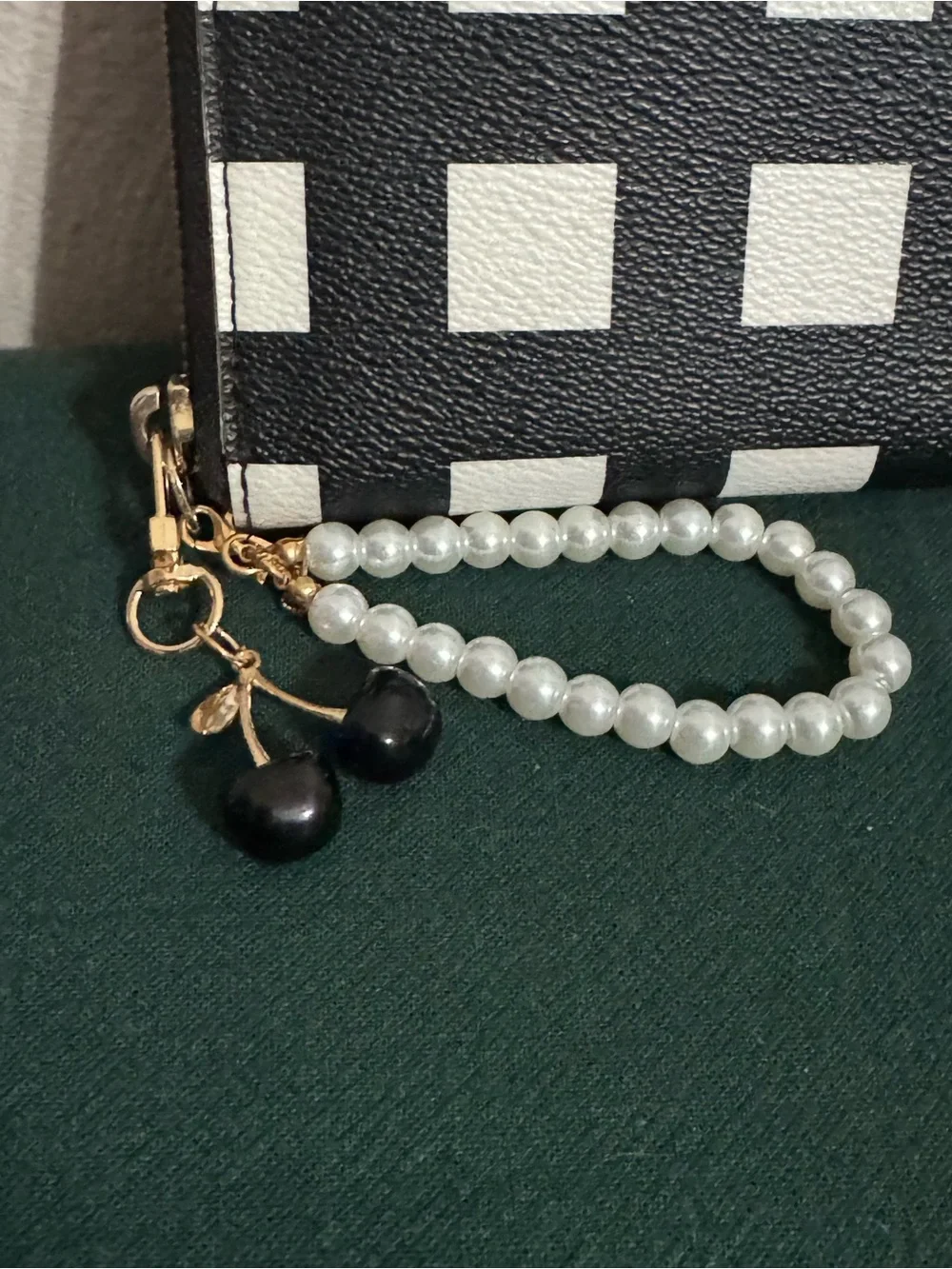 kate spade Black and White Check Zip-Around Wristlet with Pearl Strap